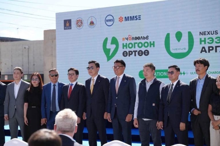 Guests and project partners on stage at the NEXUS EV Station launch
